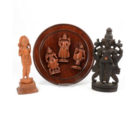 Carved teak devotional model of Ganesha, on a double lotus base, 32cm; and other carved wood models of Hindu dieties (two box