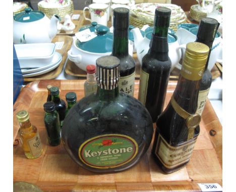 Tray of alcohol to include; Keystone Cypriot red wine, Cusenier apricot brandy, Sandeman pale sherry, miniature bottles etc. 