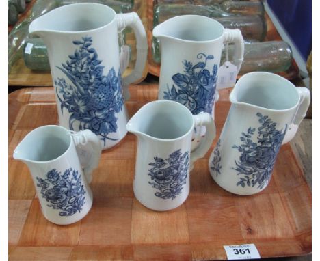 Set of five Royal Worcester graduated blue and white floral and foliate jugs with simulated bamboo handles. (B.P. 24% incl. V