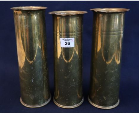 Three First World War period brass shell case vases, marked 18 pounder. (2 + 1)(B.P. 24% incl. VAT)