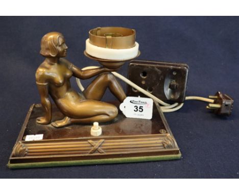 Art Deco design bronzed metal figural table lamp with seated nude female figure on rectangular reeded base, together with vin