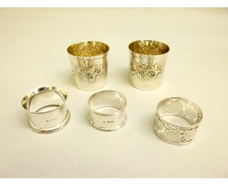 THREE SILVER NAPKIN RINGS (REYNOLDS & WESTWOOD, BIRMINGHAM 1909, ROBERT PRINGLE & SONS, LONDON 1924, WALKER & HALL, SHEFFIELD