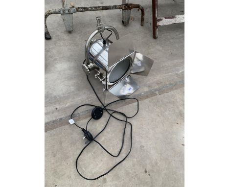 A STAINLESS STEEL THEATRE STYLE LIGHT 