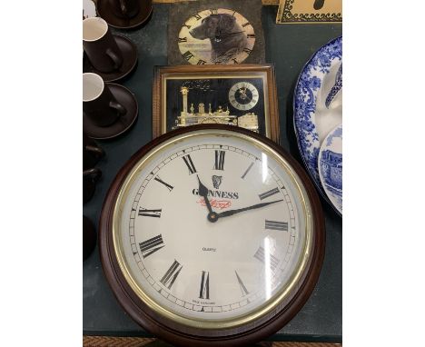 A LARGE 'GUINNESS' QUARTZ WALL CLOCK, DIAMETER 38CM, A SLATE WALL CLOCK WITH THE IMAGE OF A BLACK LABRADOR PLUS A STEAM TRAIN