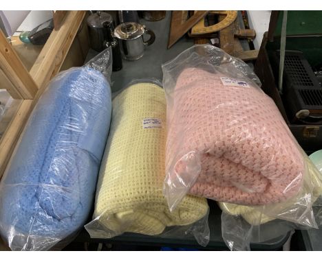 FOUR VINTAGE HONEYCOMB BLANKETS, TWO YELLOW, ONE PINK AND ONE BLUE 