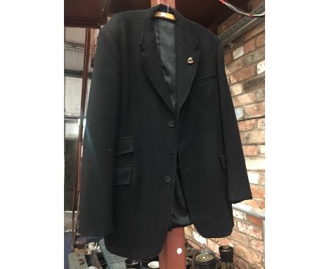 A HUNTING JACKET WITH BRITISH EQUESTRIAN TEAM ENAMEL BADGE 