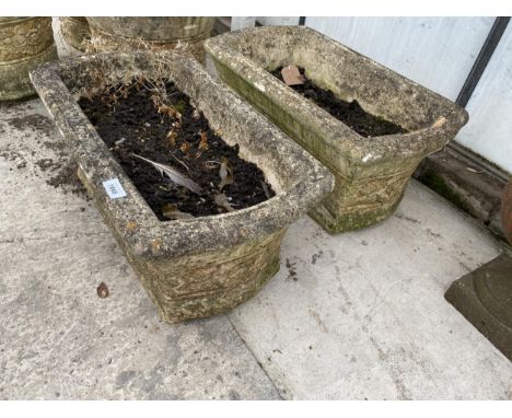 A PAIR OF RECONSTITUTED STONE GARDEN TROUGH PLANTERS 