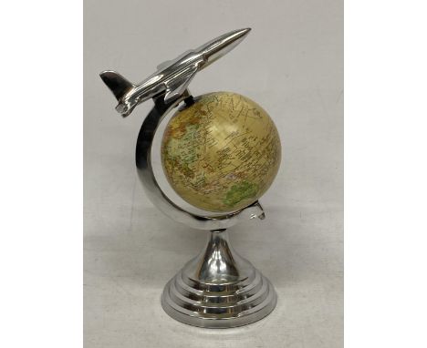 A DESK GLOBE WITH CHROME EFFECT BASE AND AEROPLANE DESIGN 