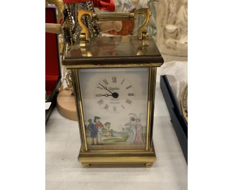 A CERAMIC SPODE CLOCK IN A BRASS CASE 