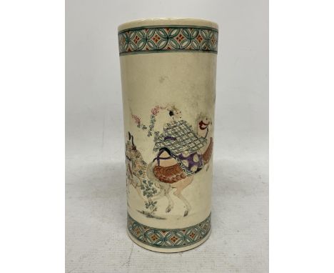 AN ORIENTAL STONEWARE STICK STAND WITH FIGURAL DESIGN 