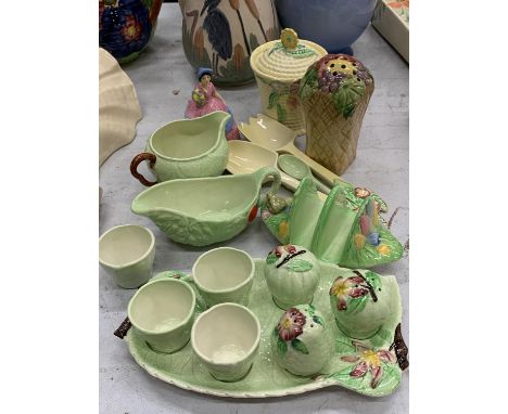 A COLLECTION OF CARLTON WARE TO INCLUDE LEAF PATTERN CRUET SET ON A TRAY, JUGS, CERAMIC SERVING UTENSILS, A LADY FIGURE AND A