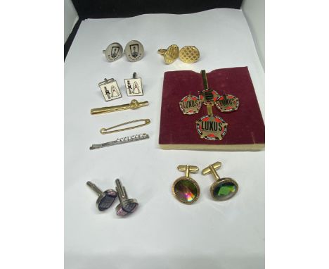 A COLLECTION OF CUFF LINKS AND TIE PINS 