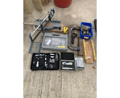 AN ASSORTMENT OF TOOLS TO INCLUDE DRILL BITS, A MITRE SAW AND A LARGE RECORD G CLAMP ETC 