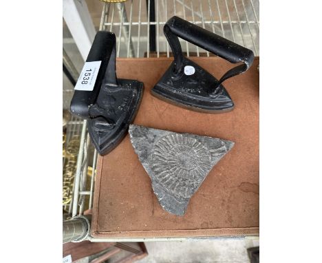 TWO VINTAGE FLAT IRONS AND A SLATE FOSSIL 