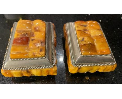 A PAIR OF VINTAGE, BELIEVED YELLOW AMBER, TRINKET BOXES WITH WHITE METAL BORDER AND BASES 