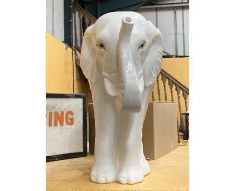 A LARGE WHITE CERAMIC ELEPHANT STICK STAND 