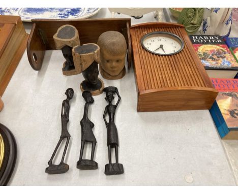 A QUANTITY OF TREEN TO INCLUDE A MANTLE CLOCK, THREE FIGURES, THREE CARVED HEADS AND A SHELF 