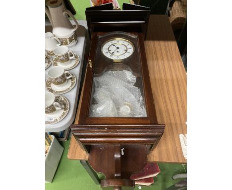 A VIENNA WALL CLOCK WITH WEIGHT AND PENDULUM 