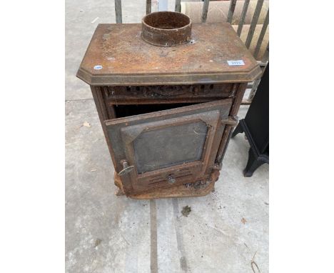 A VINTAGE CAST IRON LOG BURNER 