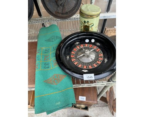 A VINTAGE ROULETTE GAME CONSISTING OF A WHEEL, COUNTERS AND CLOTH ETC 