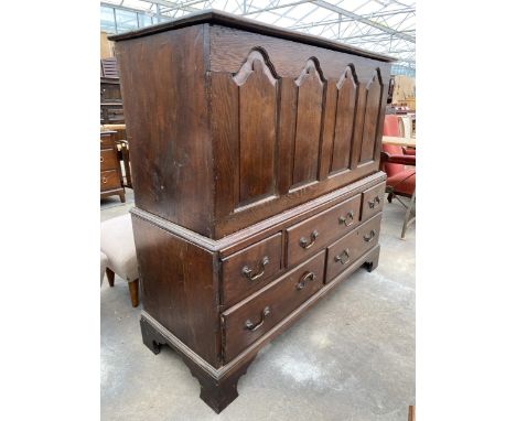 A GEORGIAN OAK FOUR PANEL MULE CHEST WITH FIVE DRAWERS TO THE BASE, 52" WIDE, ON BRACKET FEET 