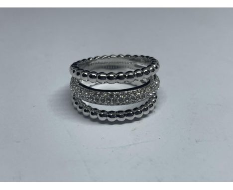 A SWAROVSKI CRYSTAL RING WITH LABEL IN A PRESENTATION BOX WITH SLEEVE SIZE Q/R 