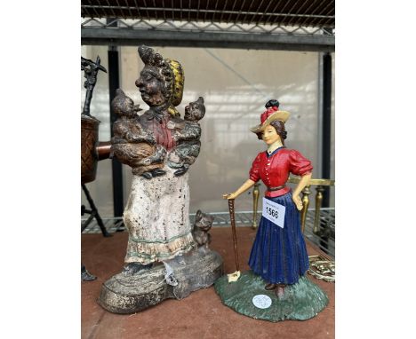 TWO VINTAGE CAST IRON DOOR STOPS TO INCLUDE A PUNCH AND JUDY EXAMPLE 