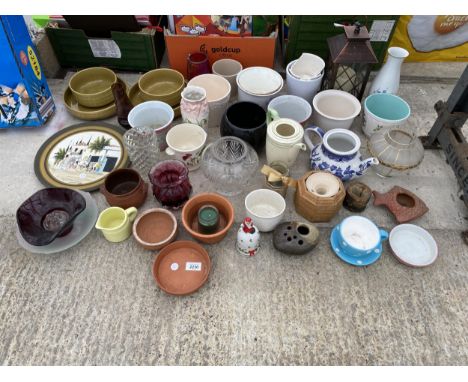 AN ASSORTMENT OF CERAMIC PLANT POTS AND CANDLE HOLDERS ETC 