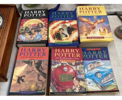 SEVEN J K ROWLING HARRY POTTER BOOKS TO INCLUDE THREE HARD BACKED FIRST EDITIONS 