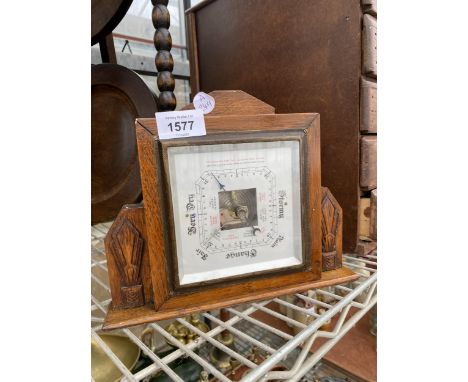 A SMALL OAK WALL HANGING BAROMETER 