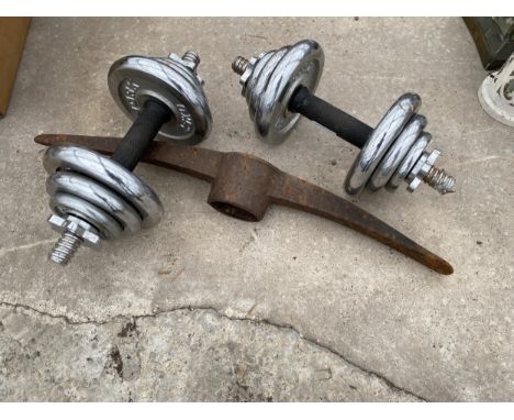 TWO DUMB BELL WEIGHTS AND A PICK AXE HEAD 