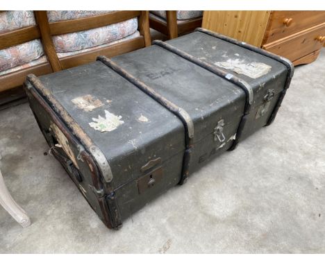 A COMPRESSED FIBRE TRAVELLING TRUNK BY WM. PARKS LTD, EASTBOURNE 