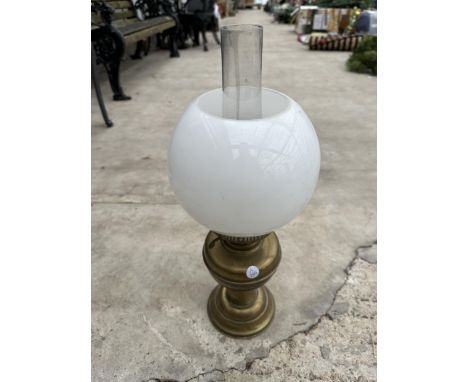 A VINTAGE BRASS OIL LAMP WITH GLASS SHADE AND FUNNEL 