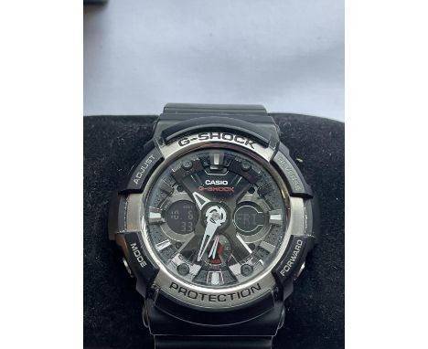 A CASIO G SHOCK WRIST WATCH SEEN WORKING BUT NO WARRANTY 