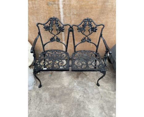 A CAST ALLOY TWO SEATER GARDEN BENCH 