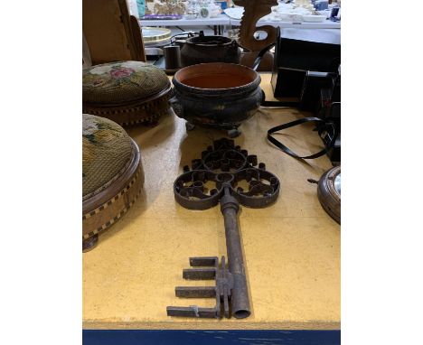 A VERY HEAVY CAST GLUE/COOKING POT, A BLACK CERAMIC PLANTER PLUS A LARGE METAL KEY 