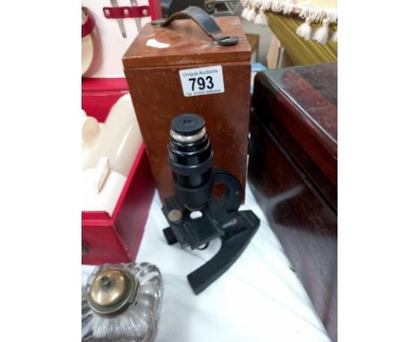 An old microscope in mahogany box