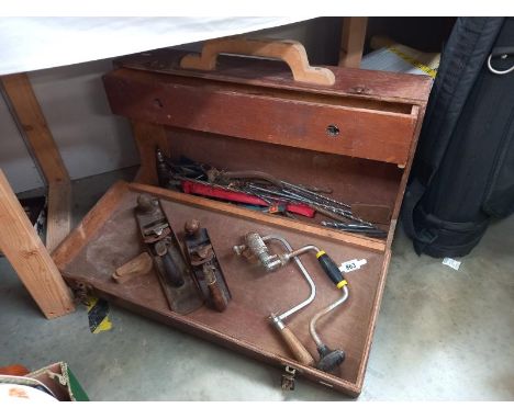 An early 20th century wooden tool box with tools