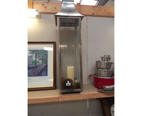 A tall candle lamp