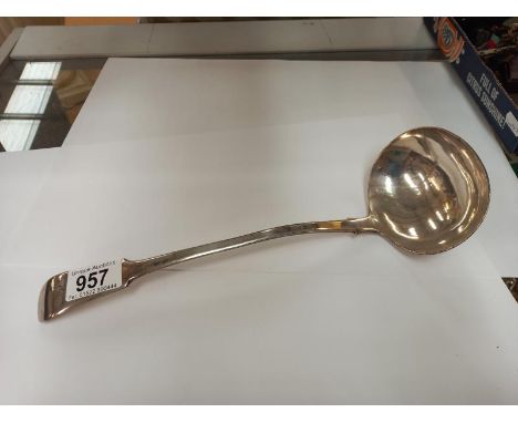 A long silver plate ladle