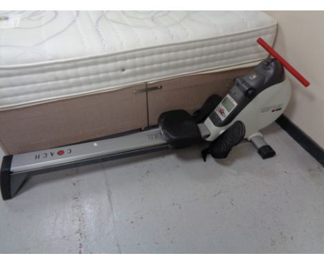A Kettler rowing machine  CONDITION REPORT: This appears to function as a rowing machine but it has an electric panel which c