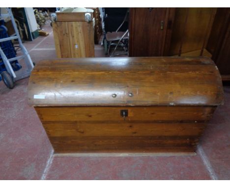 A nineteenth century pine dome topped trunk with key 