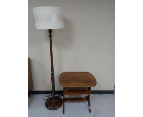 A twentieth century stained beech standard lamp with shade together with two tier occasional table 