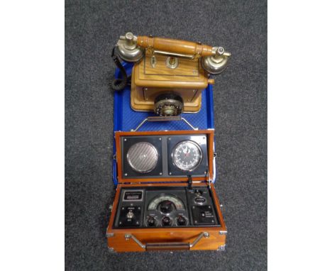 A radio alarm clock together with a traditional style telephone 