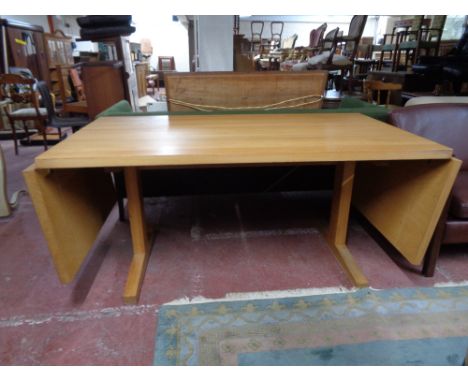 A light oak contemporary drop end dining table 