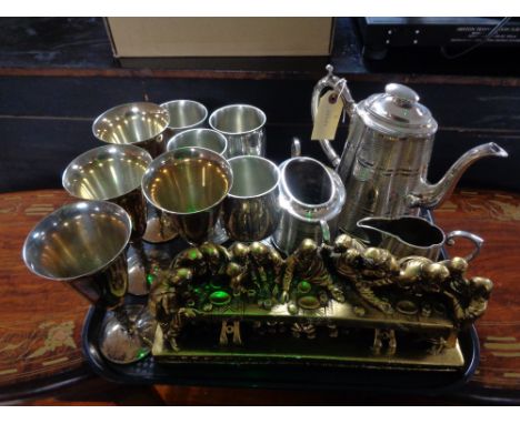 A tray of three piece plated tea service, plated goblets, gilt painted chalk figure 