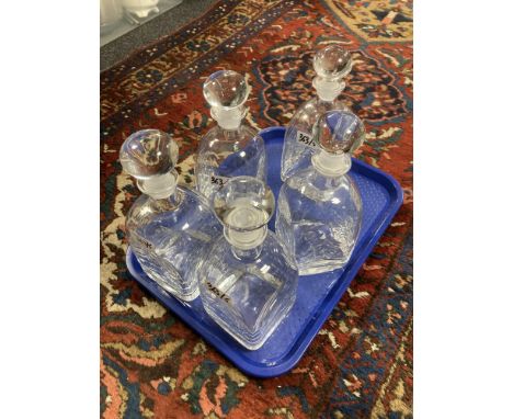 A set of five Dartington Crystal decanters, with square bases and rounded shoulders in the flask style, all with stoppers, ov