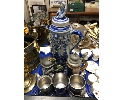 A tray of large ceramic stein, stainless tankard etc  CONDITION REPORT: Largest piece with broken and reglued lid. Firing cra