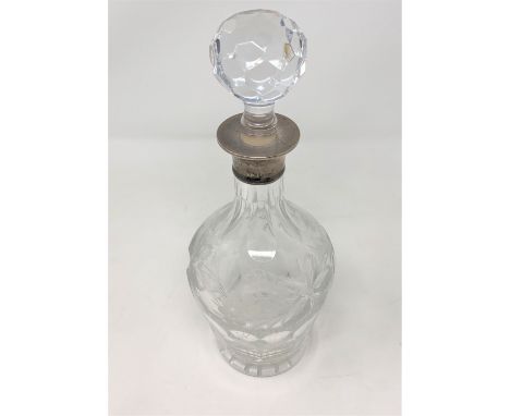 A good quality silver mounted decanter engraved with grapes and vines 