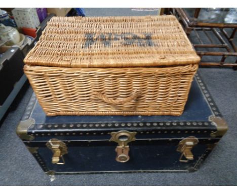 A wicker basket together with a vintage trunk 